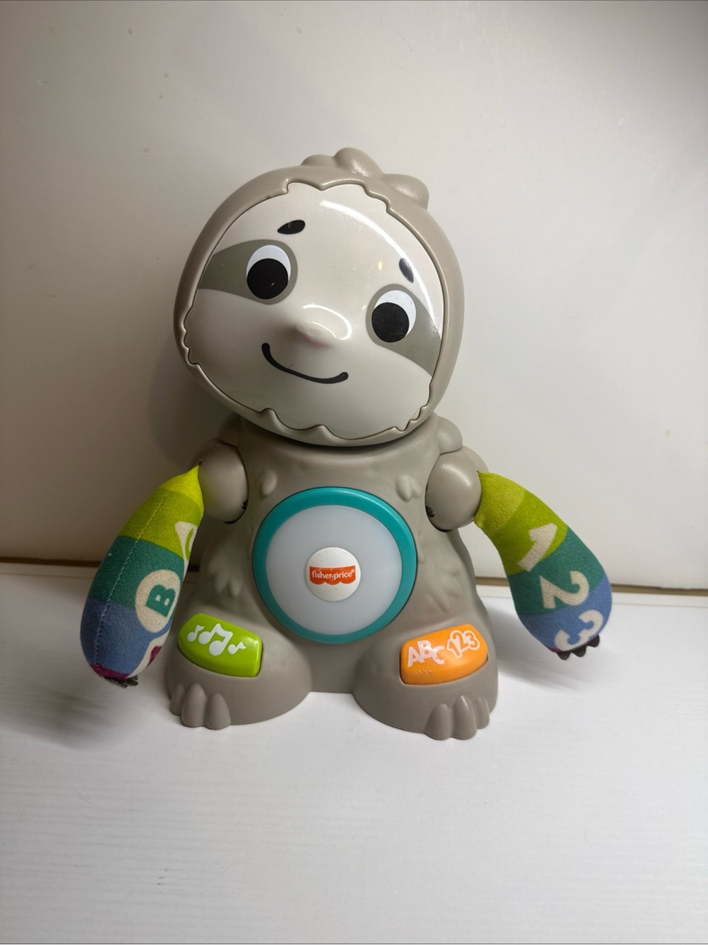 Fisher-Price Gray Sloth Learning Toy with Green and Blue Patterned Arms